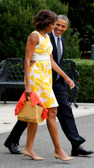 President Barack Obama and the first lady Michelle Obama depart the White House en route Joint Base Andrews August 10, 2013 in Washington, DC