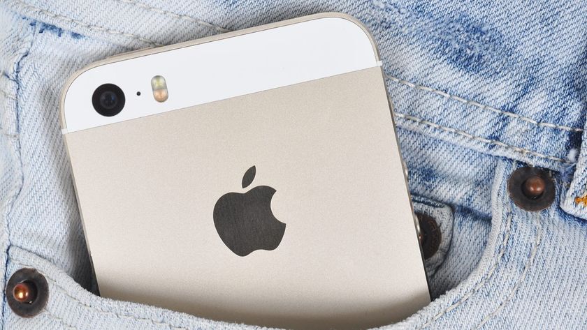 An iPhone 5S in a person's front jeans pocket