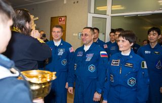 Expedition 42 Trio Receives Traditional Blessing