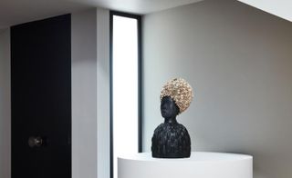Vestibule at Pacific Palisades house with bust on plinth, Simone Leigh’s Dirty South, 2016