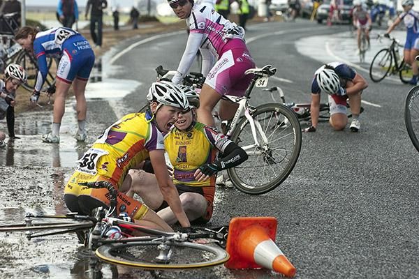 Chaos at the finish as Angela McClure (58) can't believe what just happened after a photographer turned her back on the charging peloton.