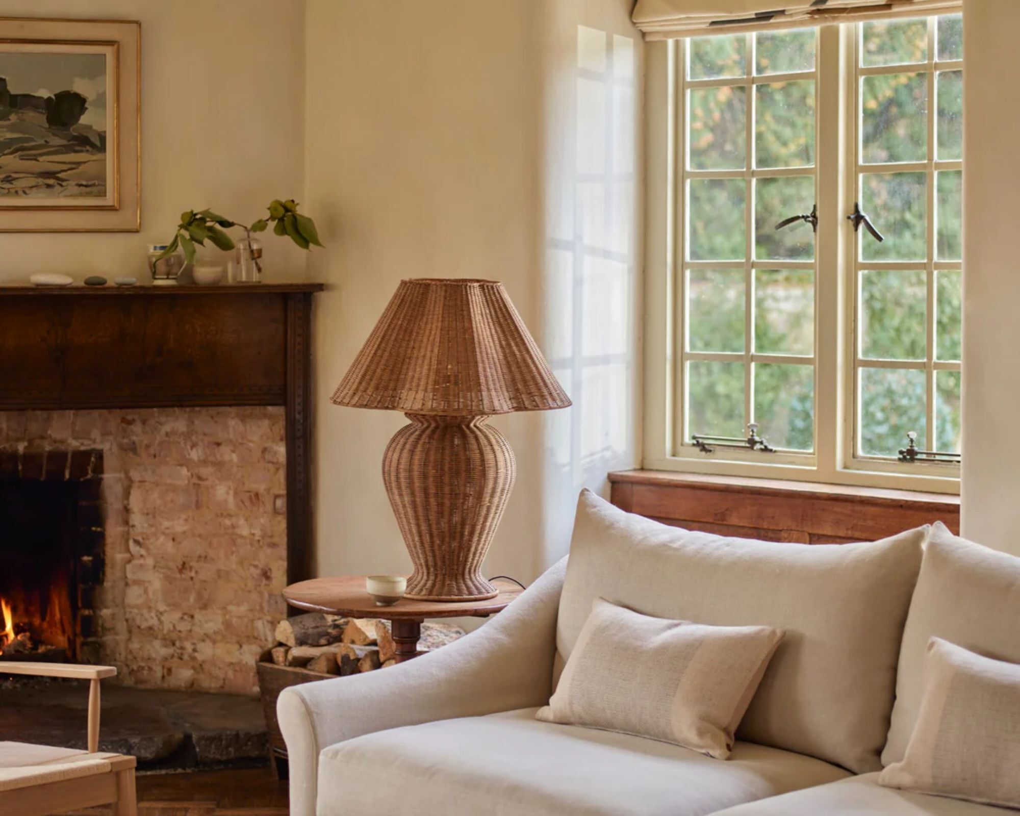 Cottage sitting room with a rattan lamp