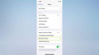 A screenshot of an iPhone screen showing the Settings app with the Blocked Contacts button highlighted