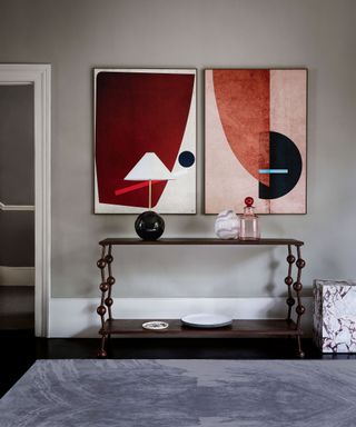 Entryway with grey walls, console and artwork