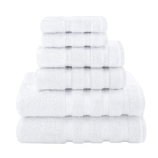 Folded white towels stacked