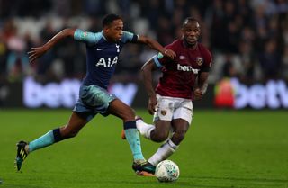 Tottenham's Kyle Walker-Peters goes past West Ham's Michail Antonio in a Premier League game in October 2018.