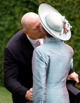 Mike Tindall kisses Princess Anne on the cheek