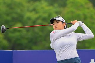 Rose Zhang strikes her tee shot with a driver