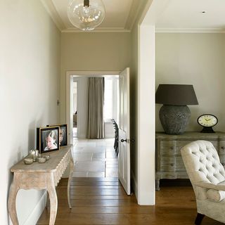 hallway with white walls and wooden flooring