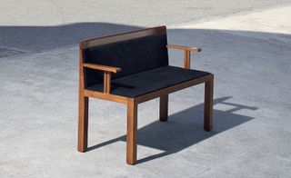 Image of a black upholstered wooden chair