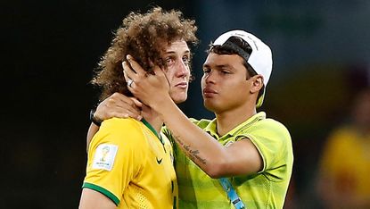 Thiago Silva comforts David Luiz after Brazil's 7-1 semi-final loss 