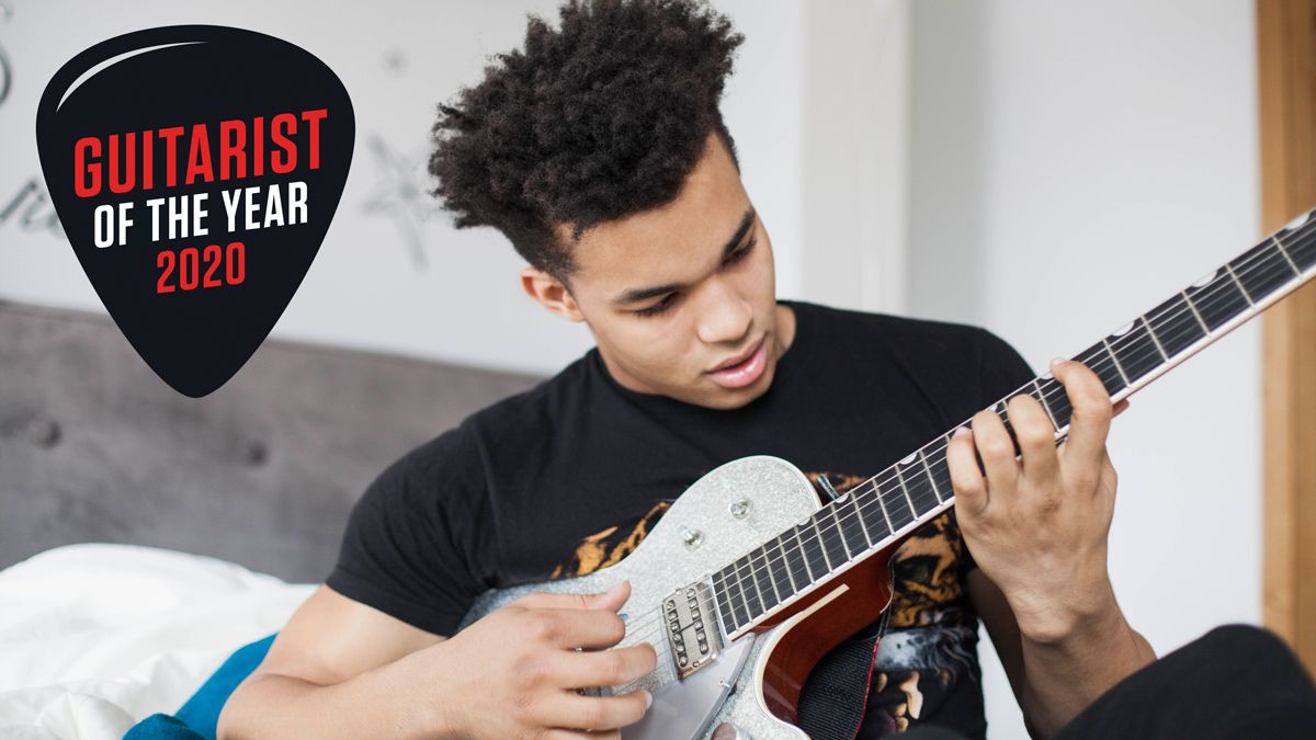 Young man playing electric guitar