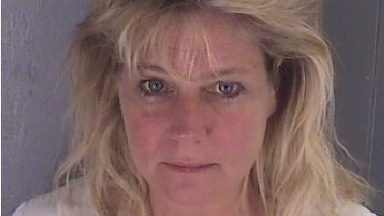 Wife of Trump ethics lawyer arrested over prison sex