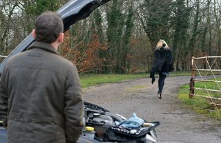 WARNING: Embargoed for publication until 00:00:01 on 01/03/2016 - Programme Name: Eastenders - TX: 11/03/2016 - Episode: 5244 (No. n/a) - Picture Shows: Ronnie starts to run towards the hotel. Billy Mitchell (PERRY FENWICK), Ronnie Mitchell (SAMANTHA WOMACK) - (C) BBC - Photographer: Kieron McCarron