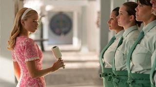 Simone (Milly Alcock, left) looks over her shoulder as seen in a promotional still for Netflix's "Sirens".