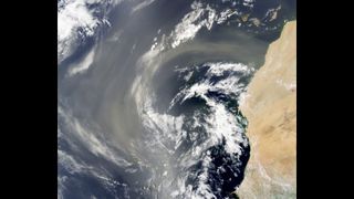A dust plume from the Sahara Desert swirls over the Atlantic Ocean in this photo taken by the Moderate Resolution Imaging Spectroradiometer (MODIS) on NASA’s Aqua satellite on July 26, 2022.