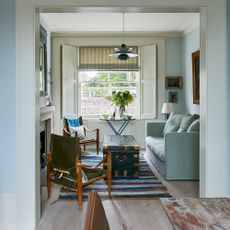 living room with wooden flooring and sofa set