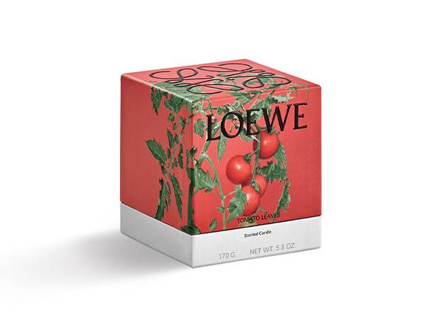 A square red box with a picture of tomatoes on it. The box says LOEWE.