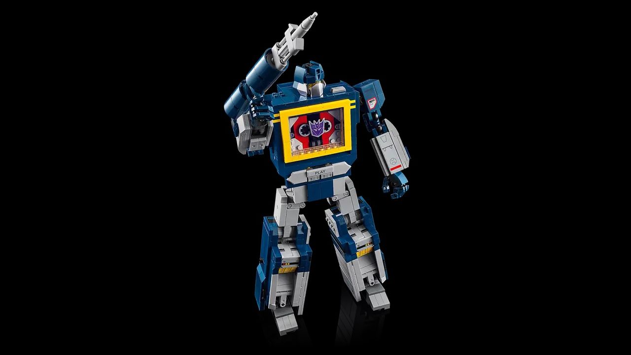 LEGO Transformers Soundwave on a black backround with his arm above his shoulder