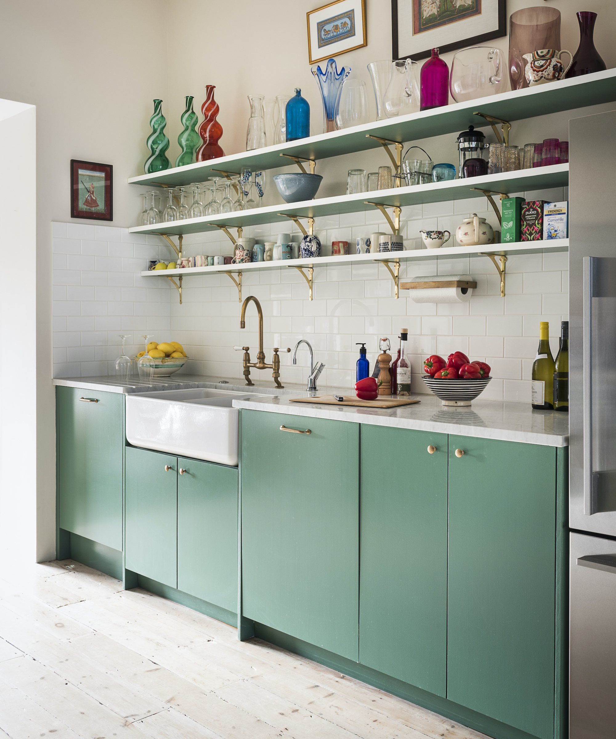 green kitchen with white backsplash