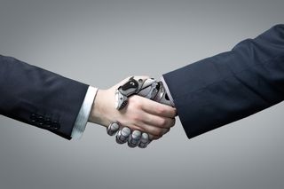 A man shaking hands with a robot