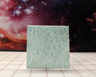 A 3D printed topographical map of the lunar far side.
