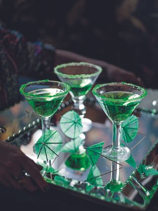 Green cocktails on a tray