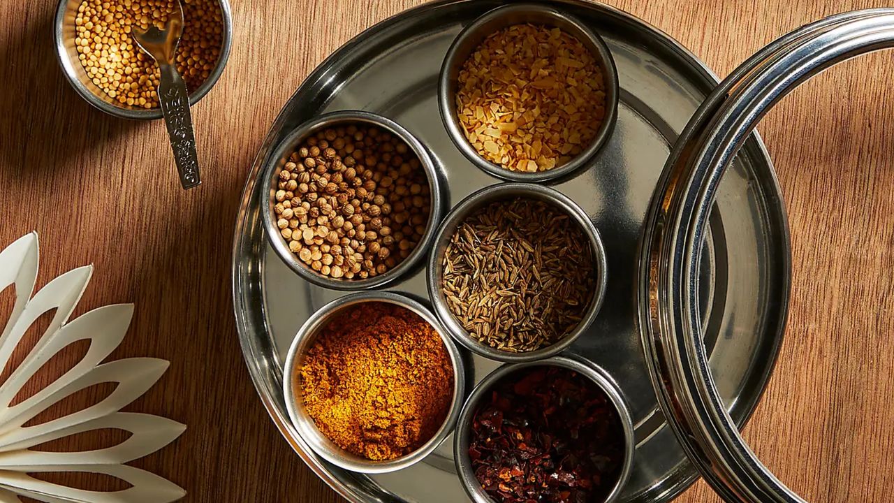 a masala dabba spice storage tin