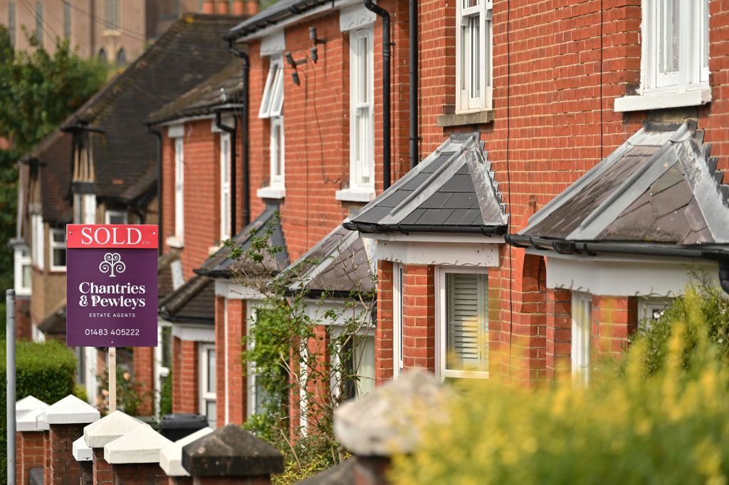 Row of houses in the UK with &#039;sold&#039; sign on display