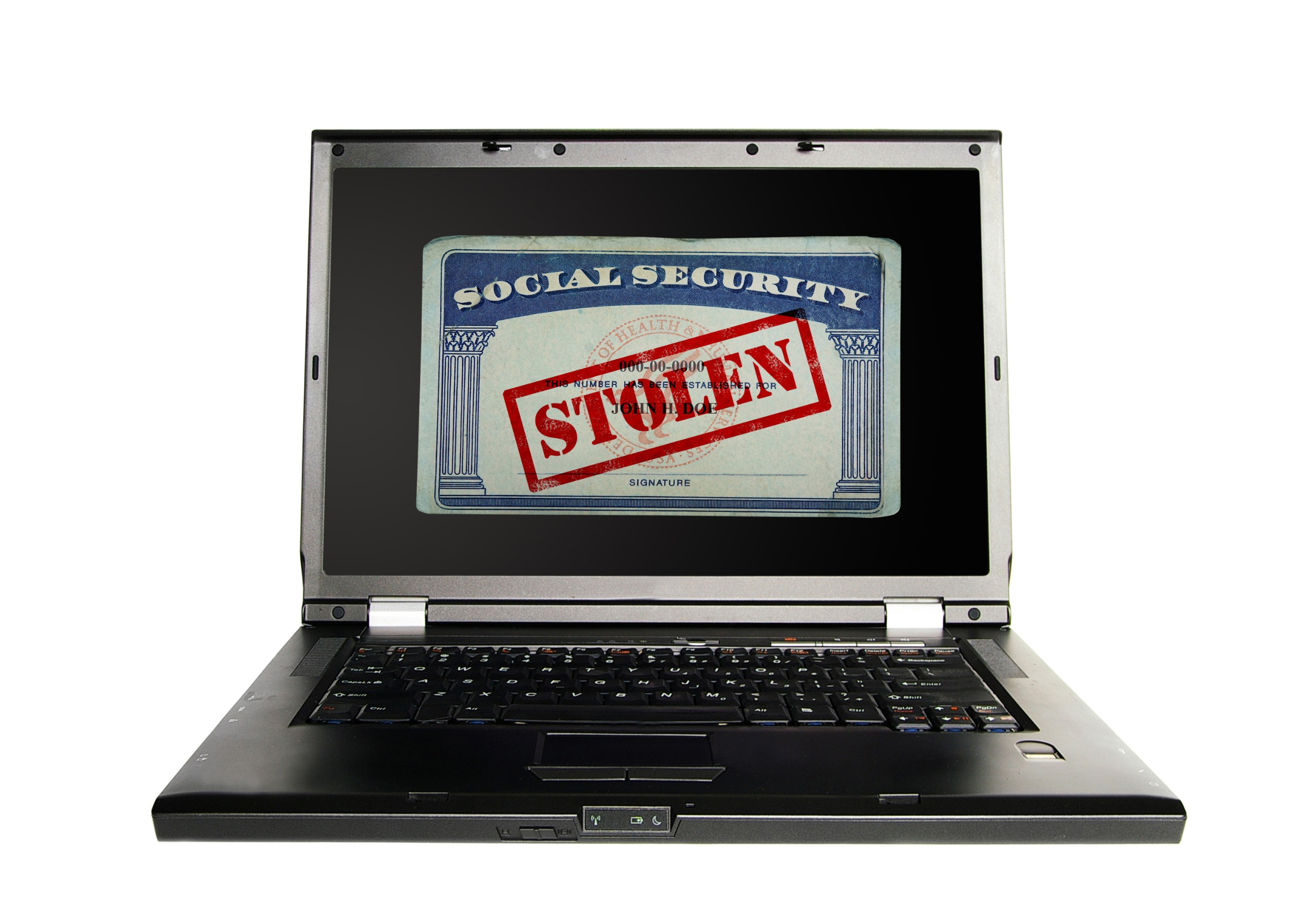 Laptop with a Social Security card and Stolen text in red -- Identity Theft concept