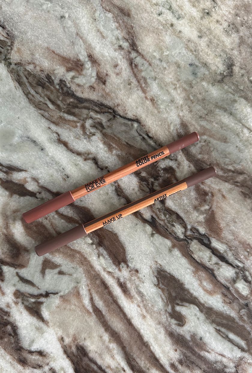 A photo of Make Up For Ever lip liners on a marble table