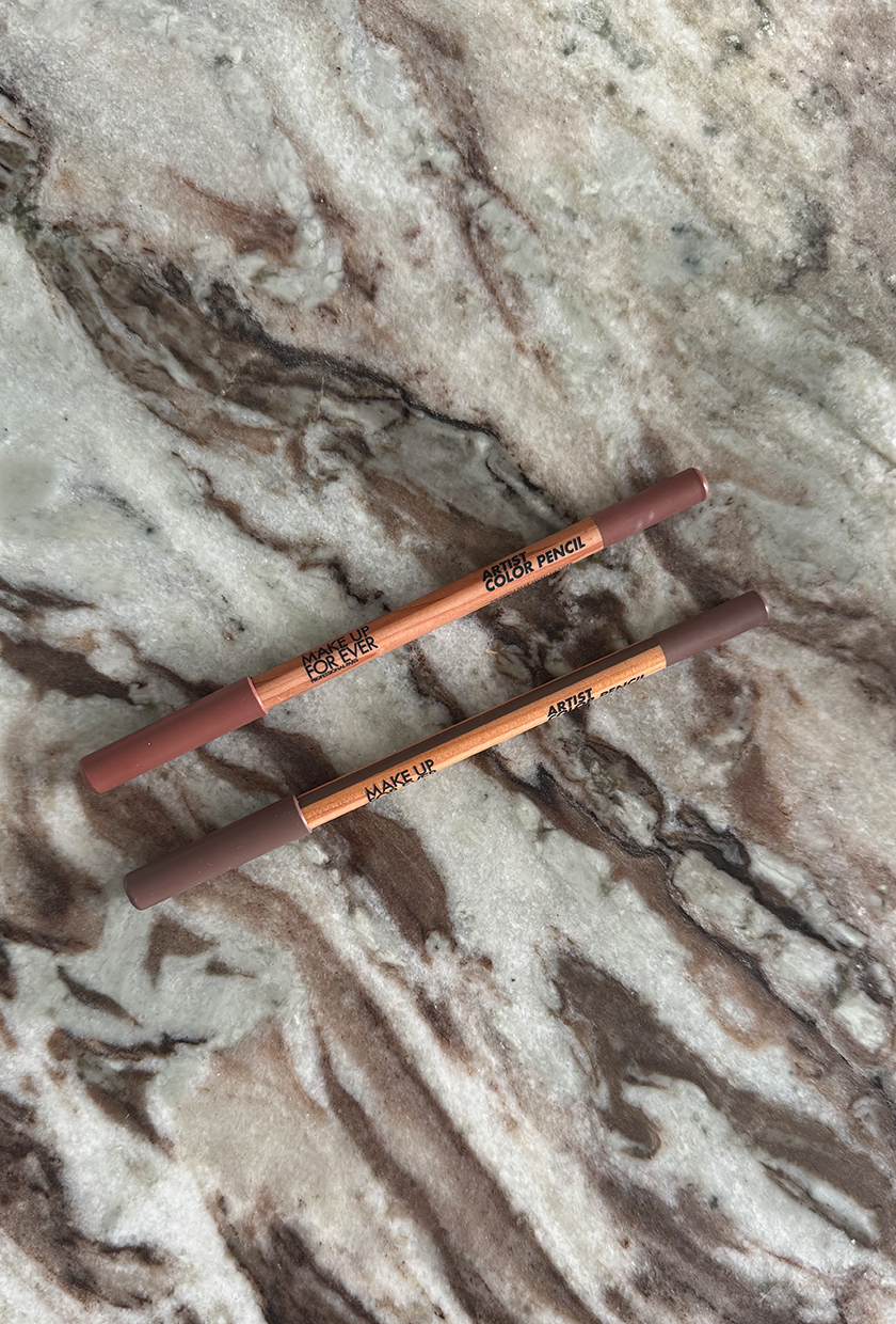 A photo of Make Up For Ever lip liners on a marble table