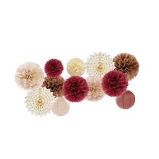 boho party decorations including poms in burgundy, white and pink