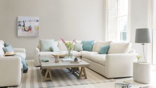 cream sofas in white living room