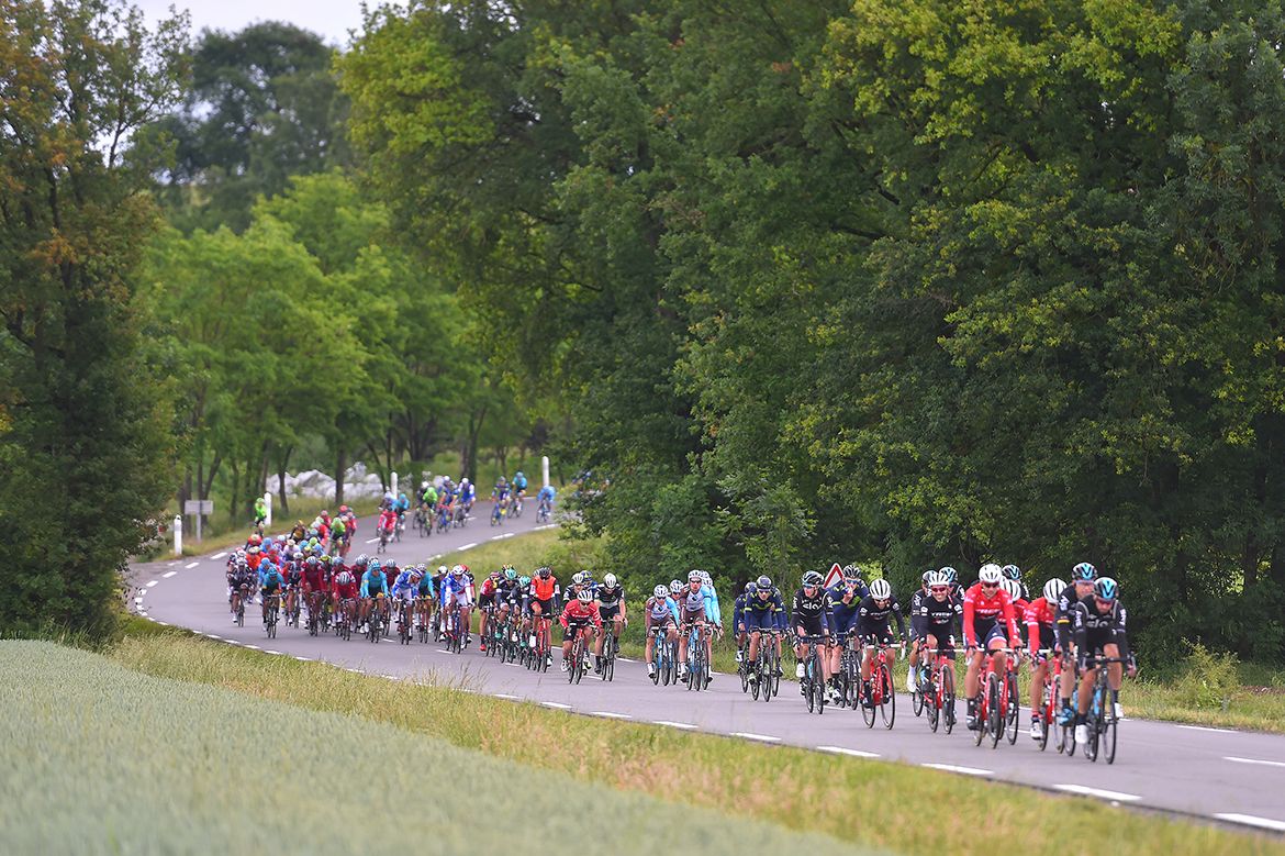 The lined-out peloton on stage 1 of the Crit&eacute;rium du Dauphin&eacute;