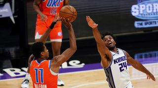 Sacramento Kings player Buddy Hield defends against a shot by the Oklahoma City Thunder's Theo Maledon during the game at Golden 1 Center on May 9, 2021 in Sacramento, California.