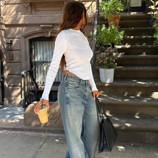 woman wearing long baggy jeans fall denim trend 2025