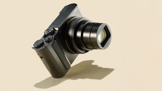 Panasonic TZ200 zoom camera on a cream background shot in a studio
