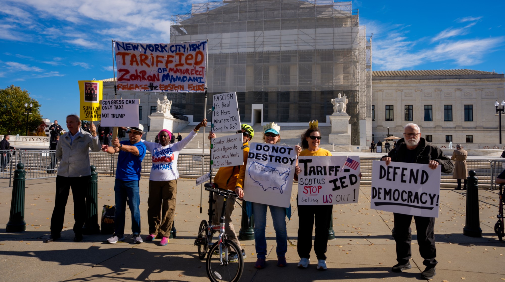 WASHINGTON, DC - NOVEMBER 5: Activists pose for photographs outside the Supreme Court on November 5, 2025 in Washington, DC. The high court is hearing arguments on the legality of the Trump Administration's tariffs. (Photo by Andrew Harnik/Getty Images)
