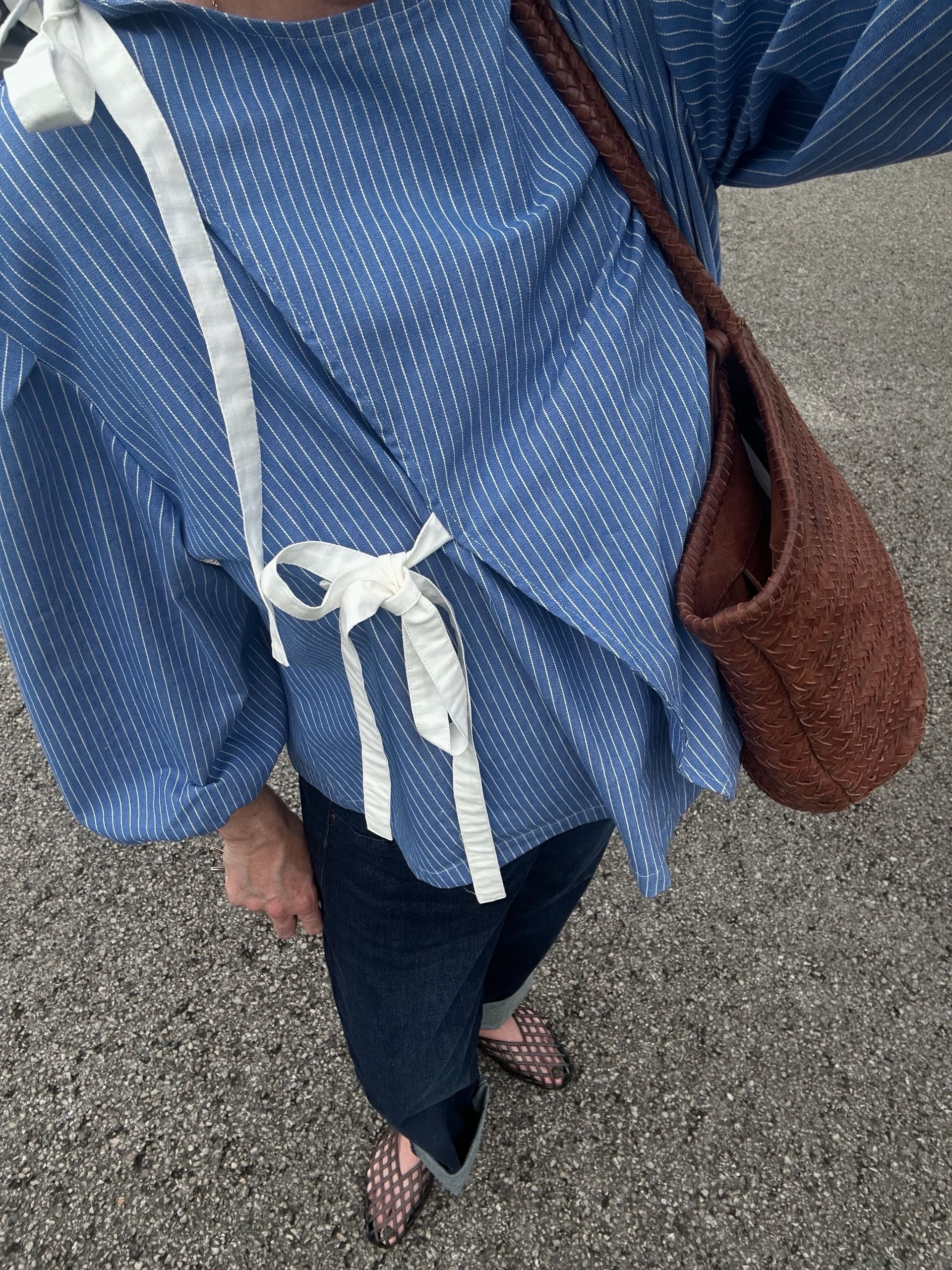 Influencer Amy Claire Peden wearing indigo jeans and mesh flats.
