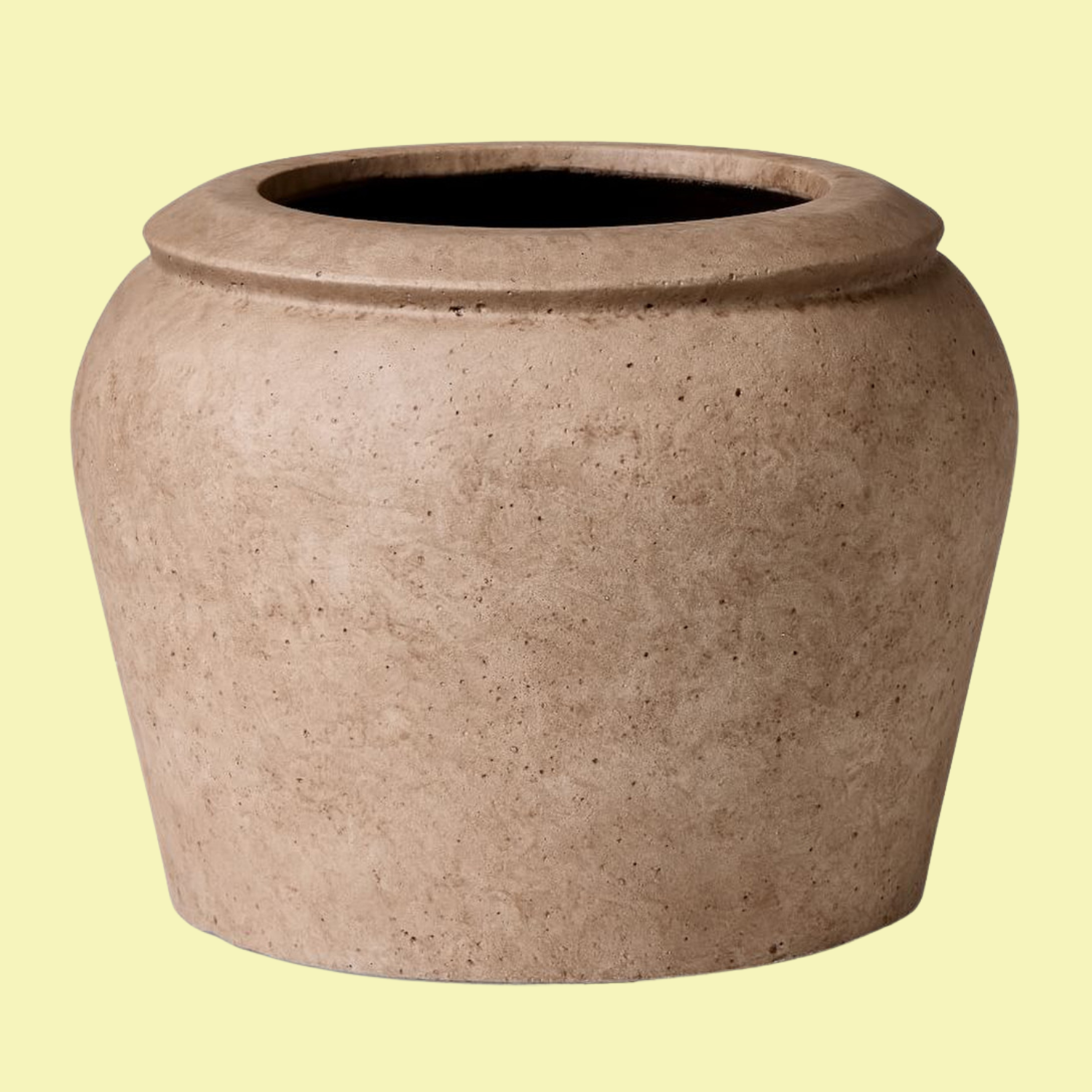 A ficonstone planter with an aged finish