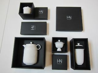 White ceramics in black boxes