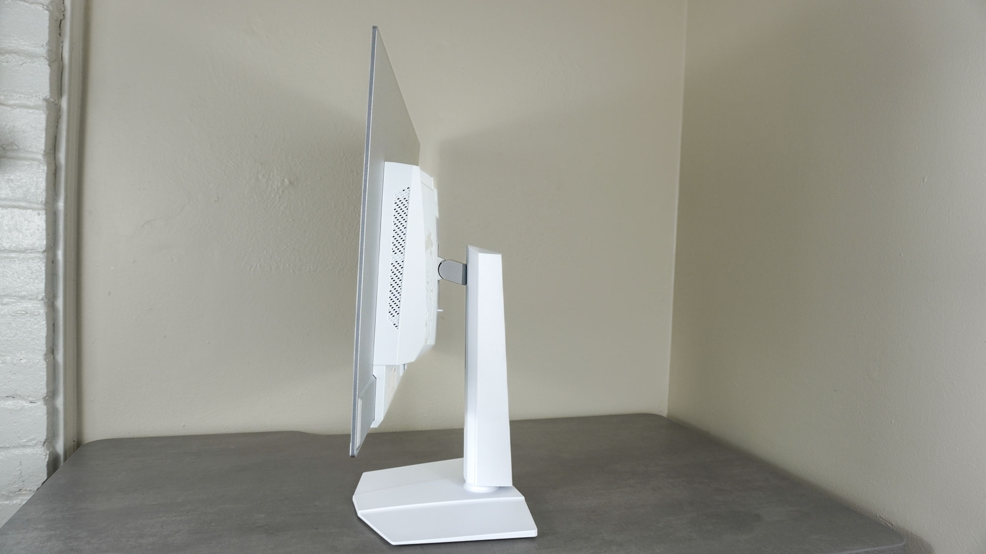A side view of the MSI MPG 321URXW QD-OLED monitor showing off its thin display