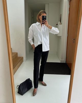 Anouk Yve wearing a white shirt with black jeans