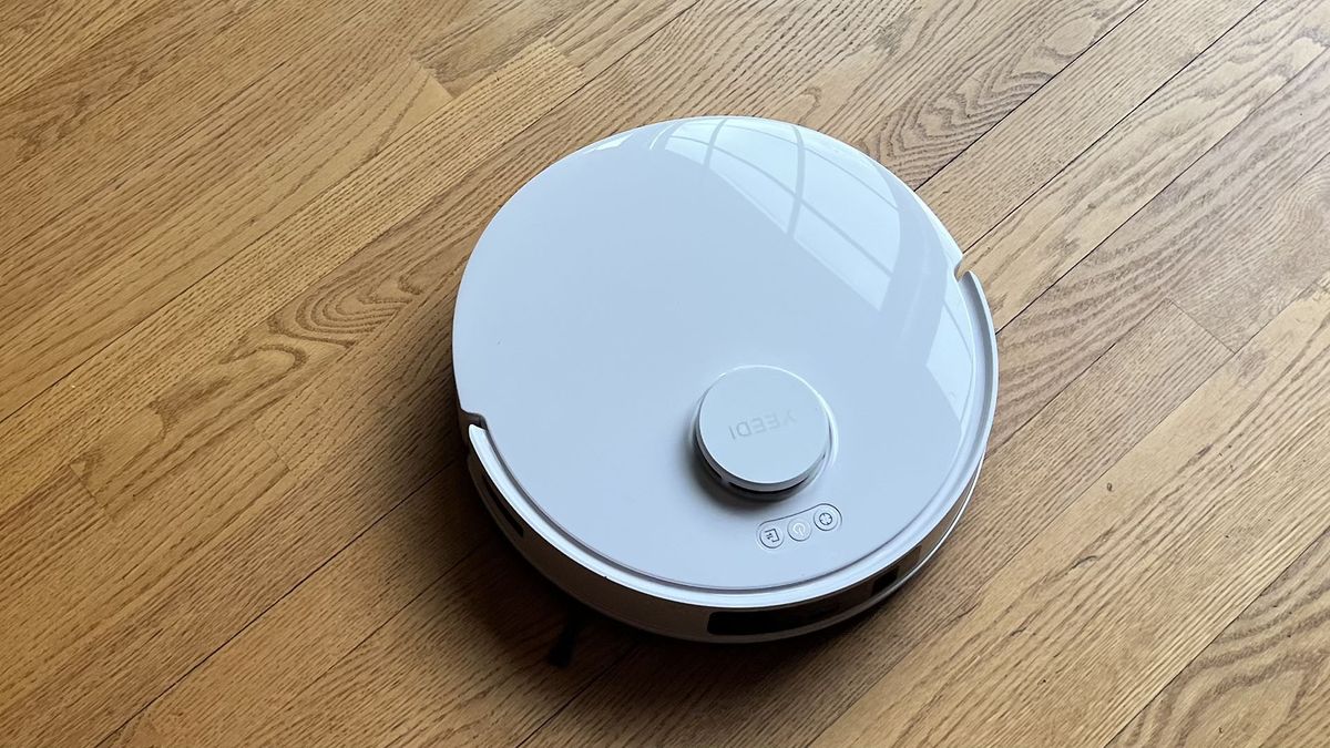 Yeedi M12 Ultra Plus robot vacuum on a wooden floor in reviewer&#039;s home