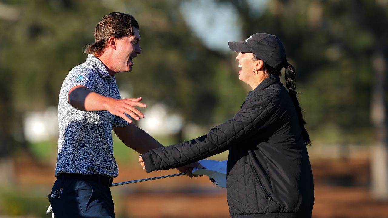 Maverick McNealy embraces wife Maya after his win in the 2024 RSM Classic 