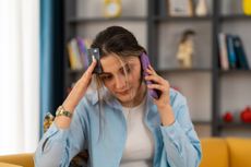 Concerned woman calling the bank