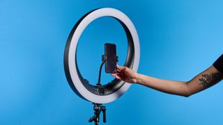 Neewer RP19H 19-inch ring light photographed in front of a blue background