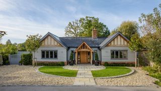 single storey home with oak frame porch and timber cladding
