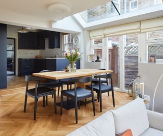 Victorian house with extension to kitchen area for a dining room and living area with parquet herringbone floor and glazed rooflights